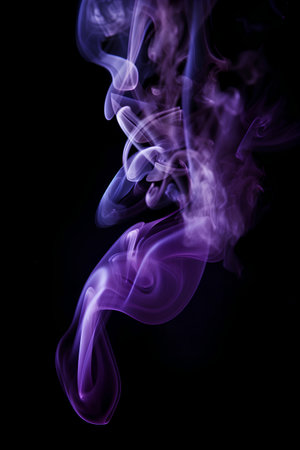 Purple smoke on a black background. Abstract background for design.の素材