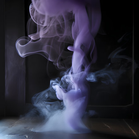 Purple smoke from incense sticks on a dark background. Copy spaceの素材