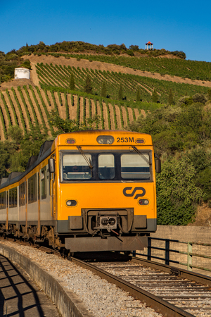 Duoro Valley, Portugal - July 1, 2017: Train travels in front of vineyardのeditorial素材