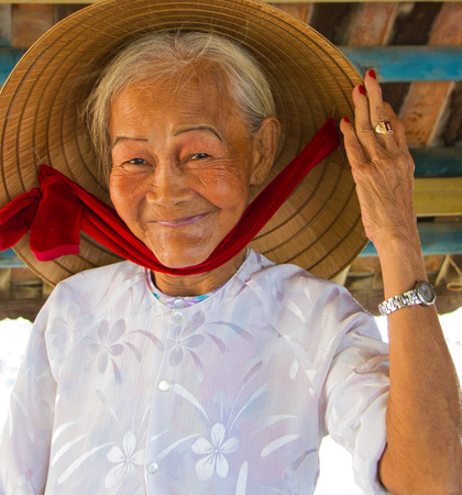 Hoi An, Vietnam - Oct 21, 2011:  woman says helloのeditorial素材