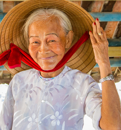 Hoi An, Vietnam - Oct 21, 2011:  woman says helloのeditorial素材