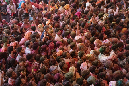 Barsana, India, Holi Festival, Feb 24, 2018 - Crowds can be seen below duirng Holi Festival in India, throwing powdered paintのeditorial素材