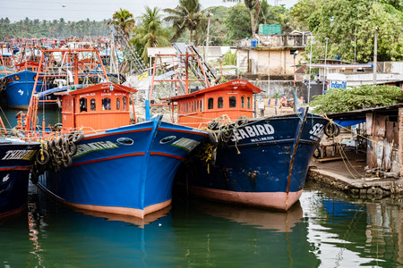 ALLEPPEY, INDIA, MAR 13, 2018: Fishing boats are tied up in a row in harbor