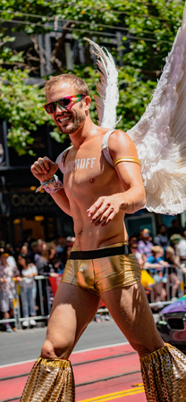 SAN FRANCISCO, CALIFORNIA, JUNE 24, 2018:  GAY PRIDE PARADE - Corporate Smirnoff liquor marches with angles on stiltsのeditorial素材