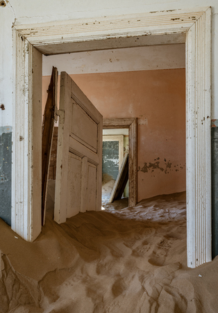 Sand has invaded and taken over these rooms in Kolmanskoppe, Namibiaの写真素材