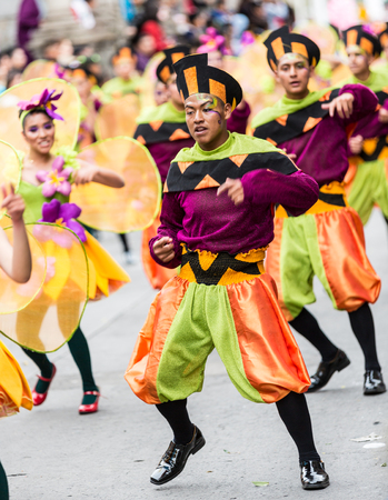 Ambato, Ecuador / Feb 15, 2015 - Group in costume dances at Carnaval paradeのeditorial素材