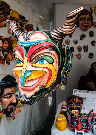 Cuenca, Ecuador / November 4, 2017 - Mask sculptor shows his wares at the Cuenca Independence Day festivalのeditorial素材