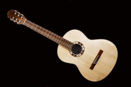 Isolated image of the front of an acoustic guitarの写真素材