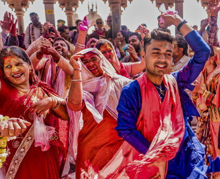Barsana, India / February 23, 2018 - Men and women rotate in a wild frenzy of dance during Holi festivalのeditorial素材