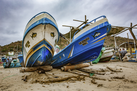 San Pedro, Ecuador - September 14, 2018 - fishing boats pulled up on beachのeditorial素材
