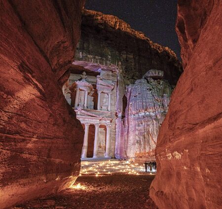 Petra At Night With Candels on Treasury Floor As Seen Through Canyon.の写真素材