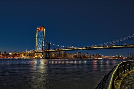 BROOKLYN, NEW YORK, MAR 27, 2018: Manhattan Bridge, as seen from Dumbo Park just after sunsetのeditorial素材