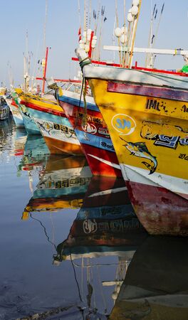 ED-Colombo, Sri Lanka - 2019-30-19 - Fishing Boats Line up at End of Day With Water Reflections.