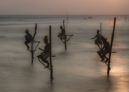 Galle, Sri Lanka - 2019-04-01 - Stilt Fishermen of Sri Lanka Spend All Day on Small Platforms to Catch Fish for Dinner.のeditorial素材
