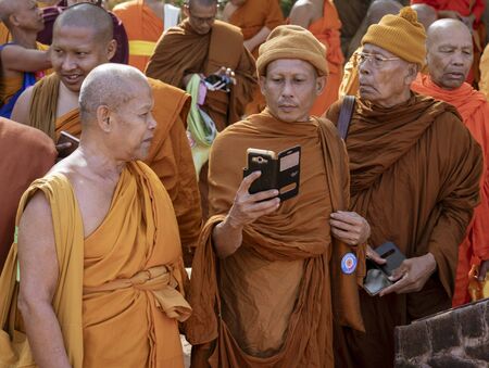 Negombo, Sri Lanka - 2019-03-22 - Monks Gather Together and a Phone Camera Comes Out.のeditorial素材