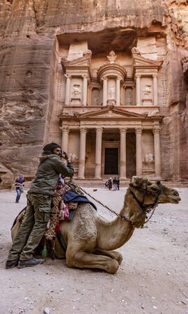 Petra, Jordan - 2019-04-21 - Camels Rest in Front of the Treasurary in Petra, Waiting For a Paid Ride.のeditorial素材