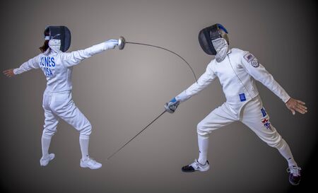 Two fencers showing point gained by arm touchのeditorial素材