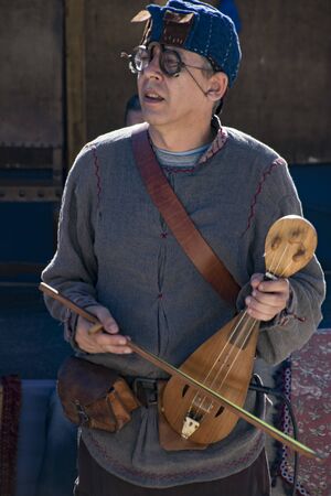 Penedono , Portugal - July 1, 2017 - Man plays Rebec string instrument in annual Medieval fairのeditorial素材