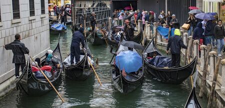 Venice, Italy - May 1, 2017: Gondolas are congested, yet try to work together to keep traffic flowing in the canals of Veniceのeditorial素材