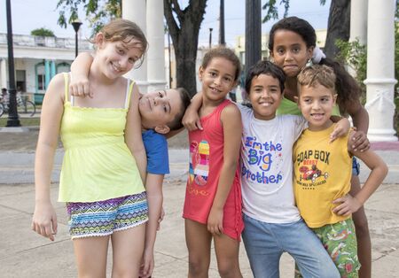 Cienfuegos, Cuba, Nov 25, 2017 - Kids ham it up and smile for the cameraのeditorial素材