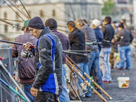 Men gather to fish off bridge in Istanbul,Turkey on Apr 1, 2016のeditorial素材
