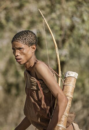 Erindi, Namibia - July 19, 2018: A native bushman gives a farewell dance to wish good hunting to the photographers in Botswanaのeditorial素材