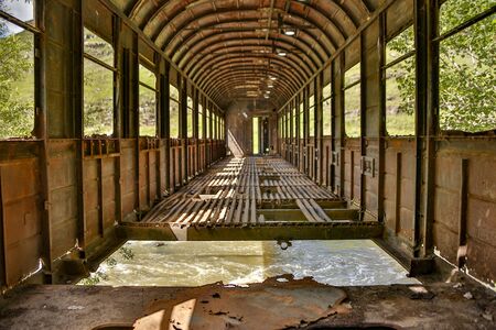 An old railroad car has been used as a bridge over a creek outside Kutasi, Georgia, but has now been left to crumbleの写真素材