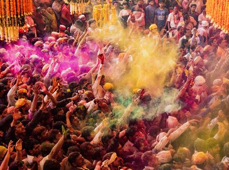 Barsana, India, Holi Festival, Feb 24, 2018 - Crowds can be seen below duirng Holi Festival in India, throwing powdered paintのeditorial素材