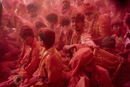 Barsana, India, Holi Festival, Feb 23, 2018 - Crowds can be seen duirng Holi Festival in India, throwing powdered paintのeditorial素材