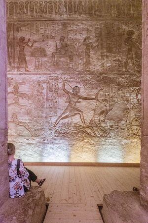 Aswan, Egypt - 2019-04-29 - Abu Simbel temple statues and hierglyphs.のeditorial素材