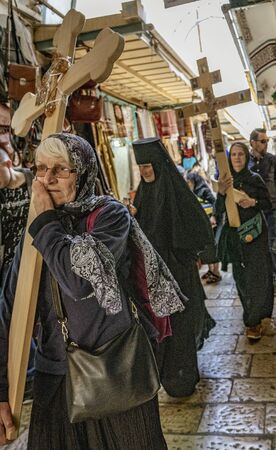 Jerusalem, Israel - 2019-04-26 - Christians carry symbolic crosses on city streets.のeditorial素材