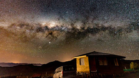 La Serena, Chile - 2019-06-30 - The Milky Way shines over a small cabin in the desert.のeditorial素材