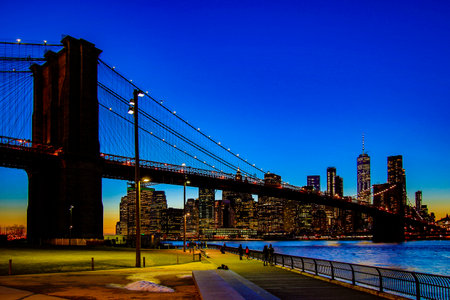 BROOKLYN, NEW YORK, MAR 27, 2018: Brooklyn Bridge, seen from Dumbo Park after sunset, during the Blue Hourのeditorial素材