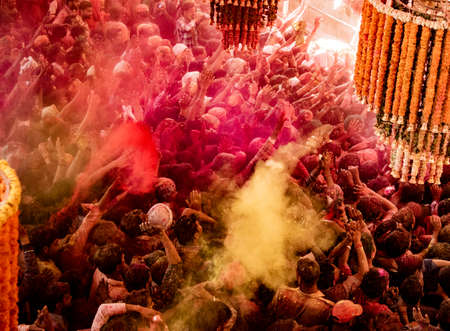 Barsana, India, Holi Festival, Feb 24, 2018 - Crowds can be seen below duirng Holi Festival in India, throwing powdered paintのeditorial素材