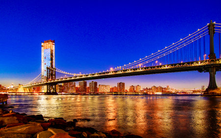BROOKLYN, NEW YORK, MAR 27, 2018: Manhattan Bridge, as seen from Dumbo Park an hour after sunset, during the blue hourのeditorial素材