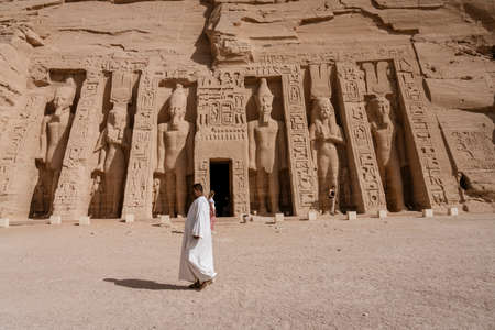 Aswan, Egypt - 2019-04-29 - Abu Simbel temple statues and hierglyphs.のeditorial素材