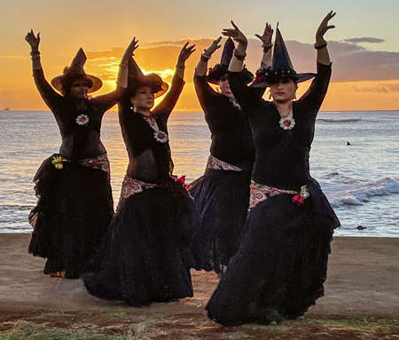 Honolulu, Hawaii -Oct 2, 2021-Four women dress as witches for Halloween.のeditorial素材