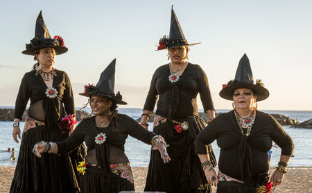Honolulu, Hawaii -Oct 2, 2021-Four women dress as witches for Halloween.