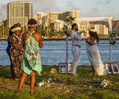 Waikiki, Honolulu, Hawaii - Oct 31, 2021-Couple gets married on the beach on Magic Island.のeditorial素材