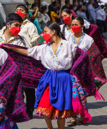 cuenca, Ecuador, Dec 24, 2021 - People dance in the traditional Traveling Child Pase del Nino Christmas Eve Parade.のeditorial素材