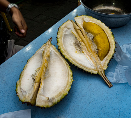 Malaysia, July 10, 2022 - Ripe durian cut open for diisplay and sale.の写真素材