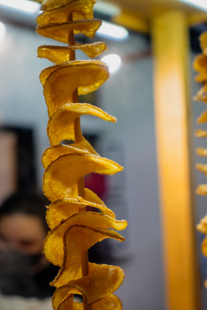 Malaysia, July 10, 2022 - Potato chips freshly fried for sale at night market.の写真素材