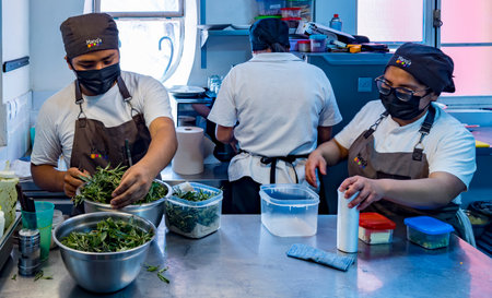 La Oaz, Bolivia, 01162023 - Student chefs prepare a delicious meal.のeditorial素材
