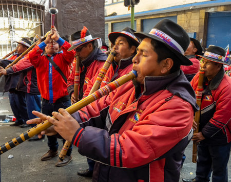La Paz, Bolivia, 01222023 - People play homemade flutes in parade to celebrate the name change of Bolivia to be inclusive of the Indigenous people.のeditorial素材
