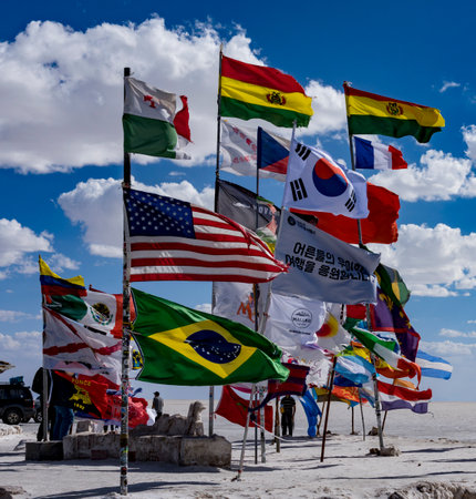Uyuni, Bolivia, 01182023 - Visitors from the world plant their country flags at the original hotel on the Bolivian Salt Flats.のeditorial素材