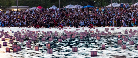 hawaii, honolulu - 20230530: Shinnyo Floating Lantern Festival - people look at the hundreds of floating lanterns.のeditorial素材