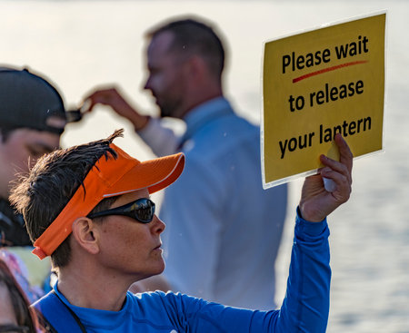 hawaii, honolulu - 20230530: Shinnyo Floating Lantern Festival - volunteers help to direct the event...