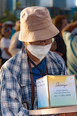 hawaii, honolulu - 20230530: Shinnyo Floating Lantern Festival - people carry their personal lantern to the ocean with wishes written for their dear departed dead.のeditorial素材