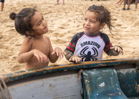 Honolulu, Hawaii/USA - 2022-08-20 - Shaka Filming Hukilau - two young children at the event enjoy entertaining the adults in the area.のeditorial素材