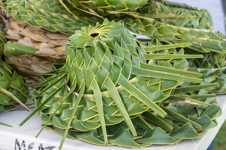 Honolulu, Hawaii/USA - 2022-08-20 - Shaka Filming Hukilau - hats made from banana leaves.のeditorial素材